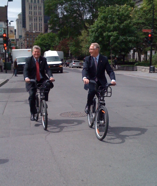 May 28: Seattle Mayor Gregory Nickels (on a visit for an inter-city study) test riding a Bixi along Montreal's Gerald Tremblay. Photo courtesy Seattle city council member, Tim Burgess.